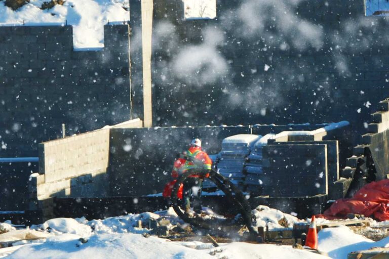 A worker dressed for working in the cold. Hypothermia can result from cold work.