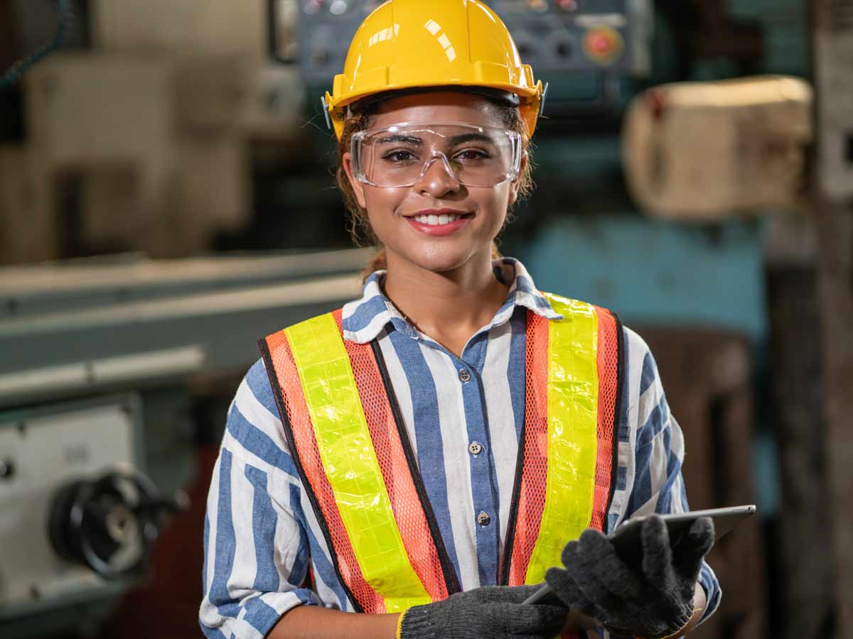 Young Woman with safety equipment. Worker Health and Safety Awareness in 4 Steps